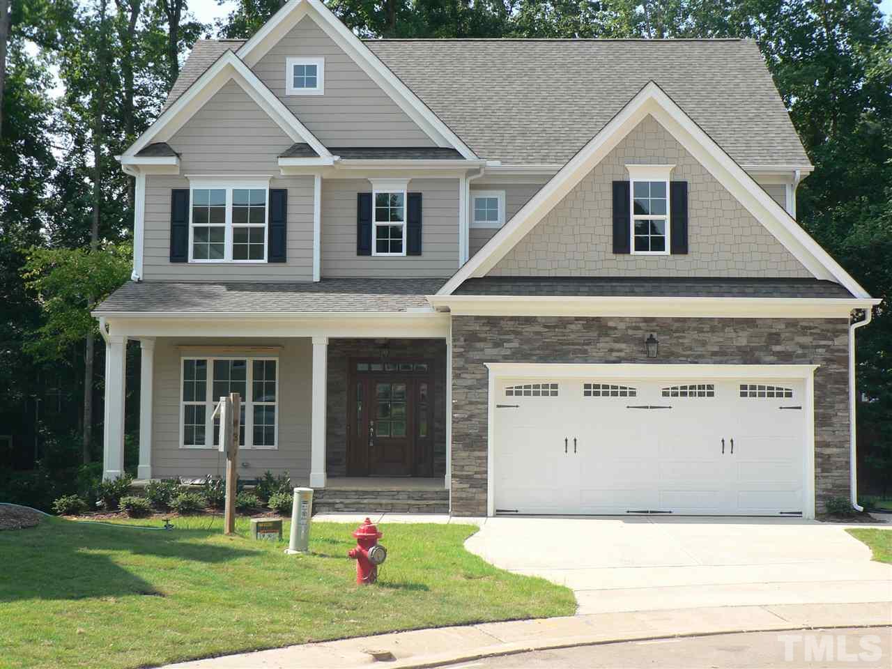 6402 Rosny Road Raleigh, NC 27613 - Photo 1 of 25 a front view of a house with a yard