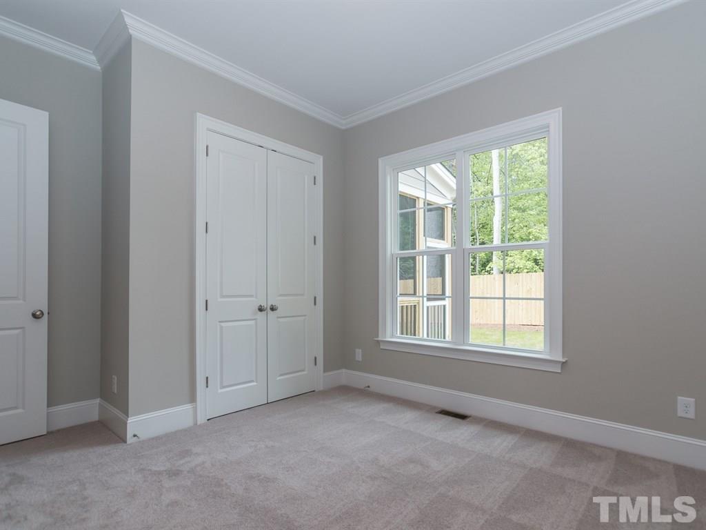 6402 Rosny Road Raleigh, NC 27613 - Photo 11 of 25 a view of an empty room with a window