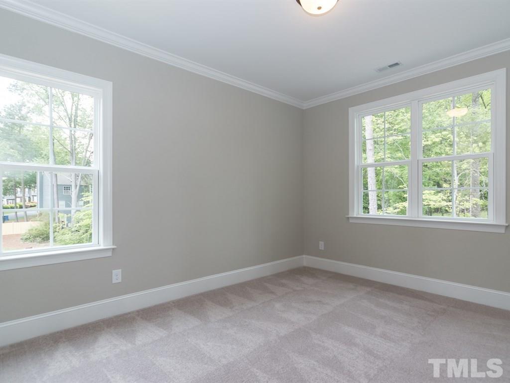 6402 Rosny Road Raleigh, NC 27613 - Photo 21 of 25 a room that has a window