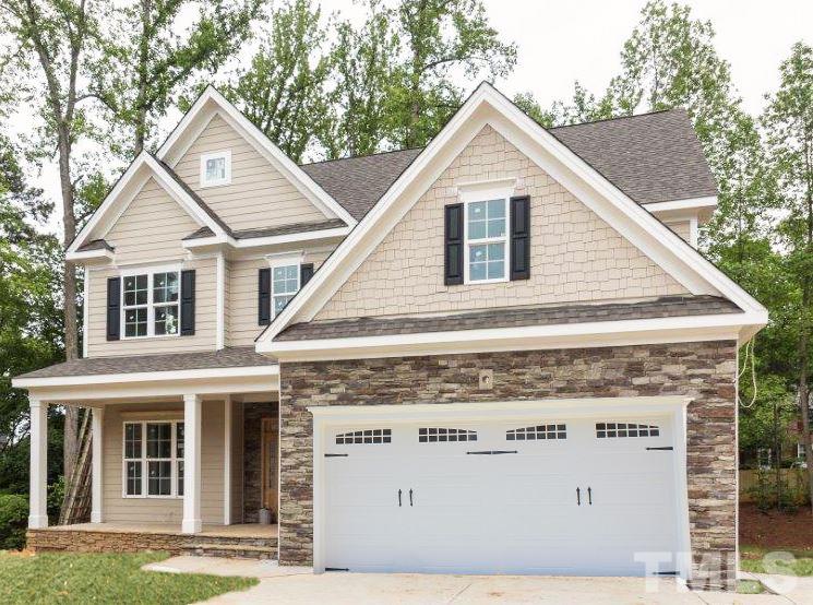 6402 Rosny Road Raleigh, NC 27613 - Photo 24 of 25 a front view of a house with a yard