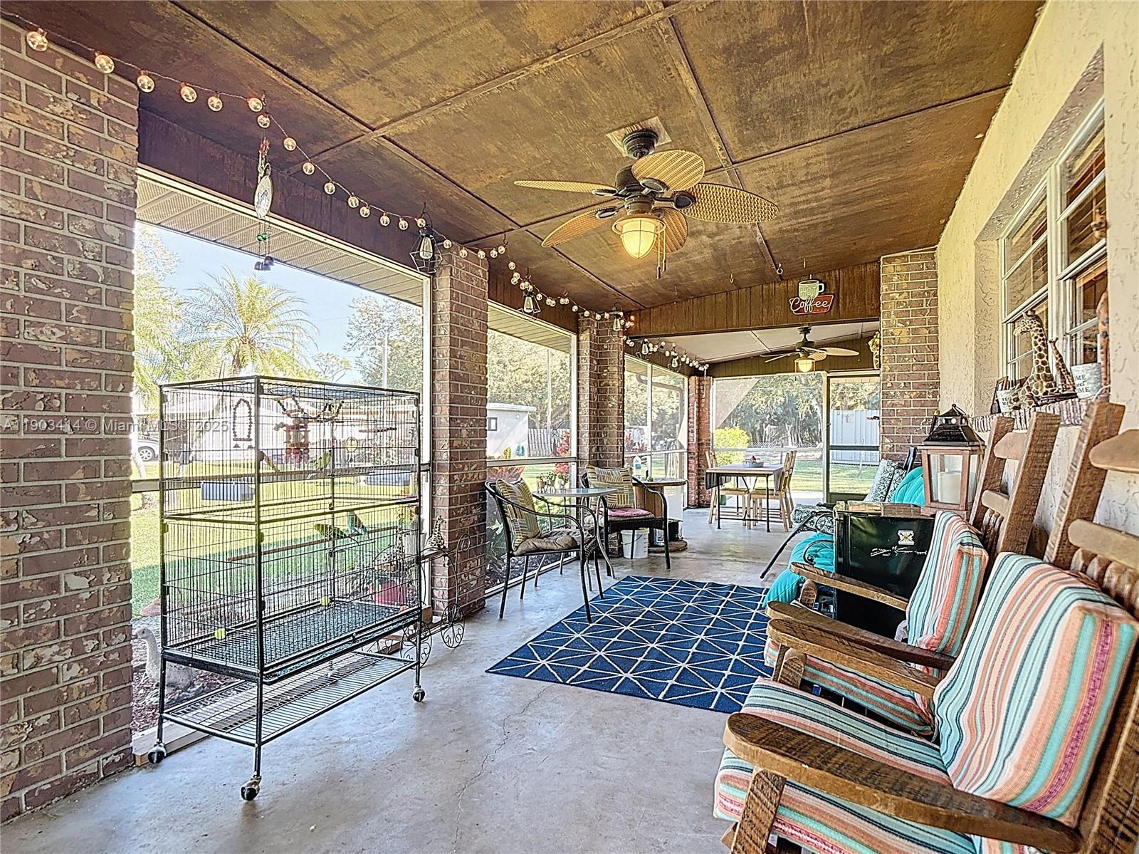 4419 Loblolly Bay Road Southwest LaBelle, FL 33935 - Photo 11 of 49 a work room with furniture and large windows