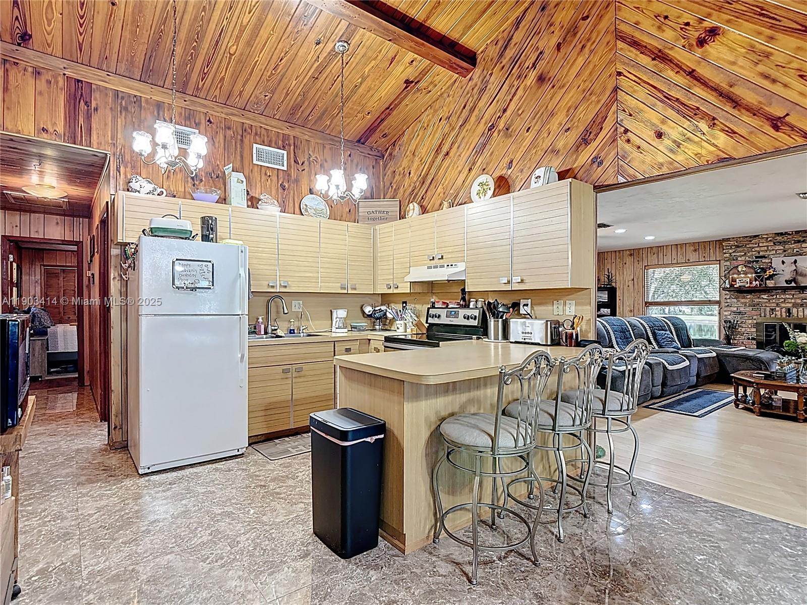 4419 Loblolly Bay Road Southwest LaBelle, FL 33935 - Photo 12 of 49 a kitchen with a sink appliances and cabinets
