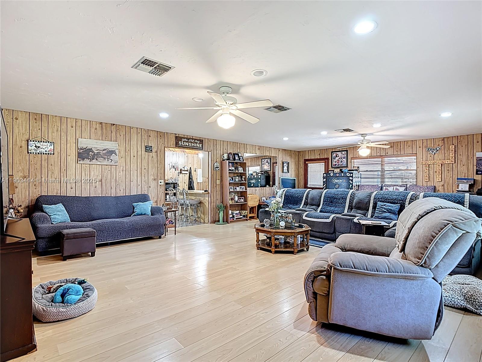 4419 Loblolly Bay Road Southwest LaBelle, FL 33935 - Photo 16 of 49 a living room with furniture and wooden floor