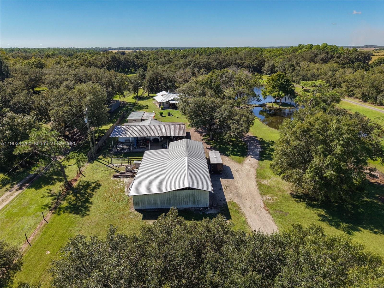 4419 Loblolly Bay Road Southwest LaBelle, FL 33935 - Photo 3 of 49 an aerial view of a house with yard swimming pool and outdoor seating