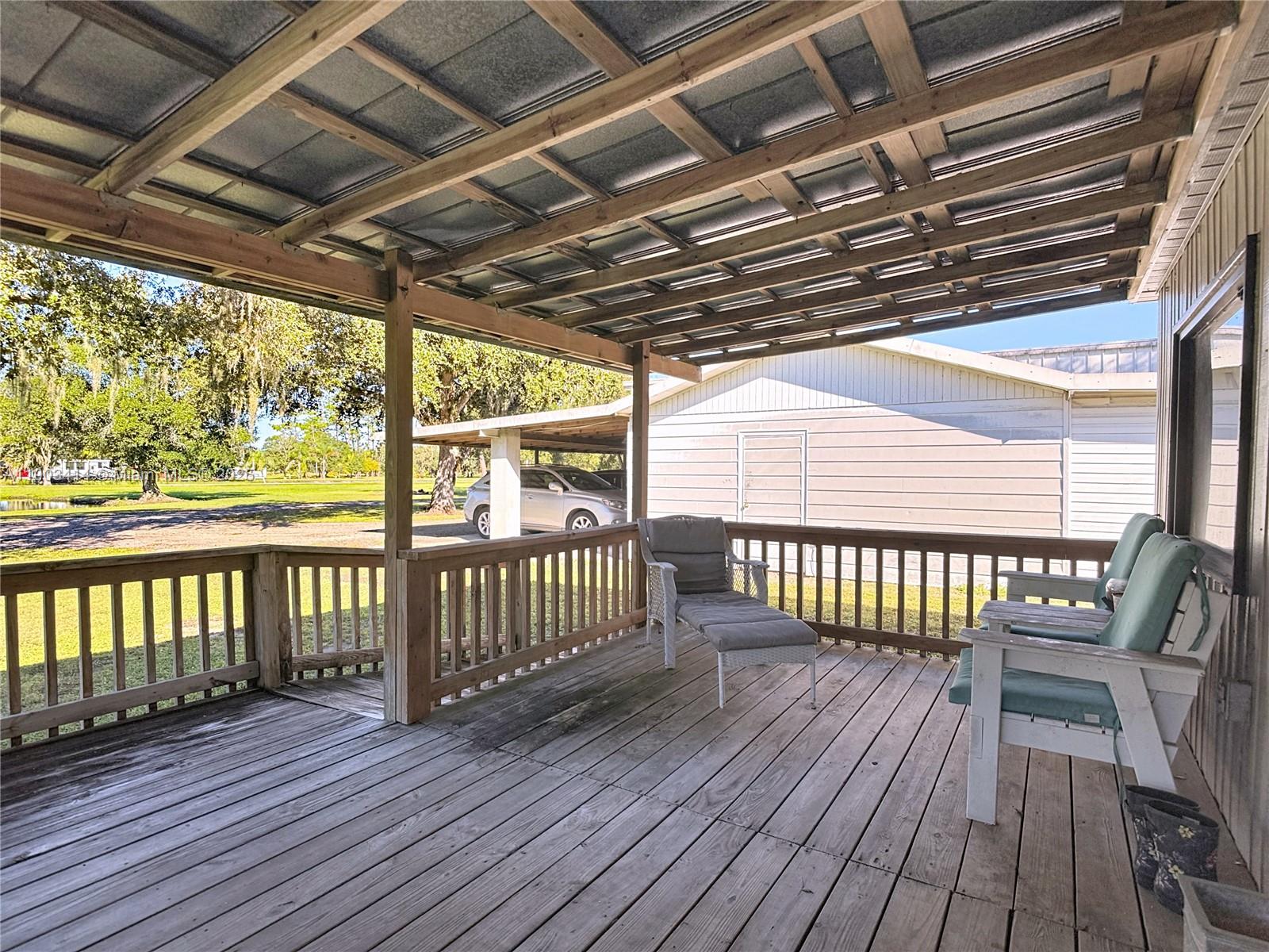 4419 Loblolly Bay Road Southwest LaBelle, FL 33935 - Photo 45 of 49 a view of porch with wooden floor