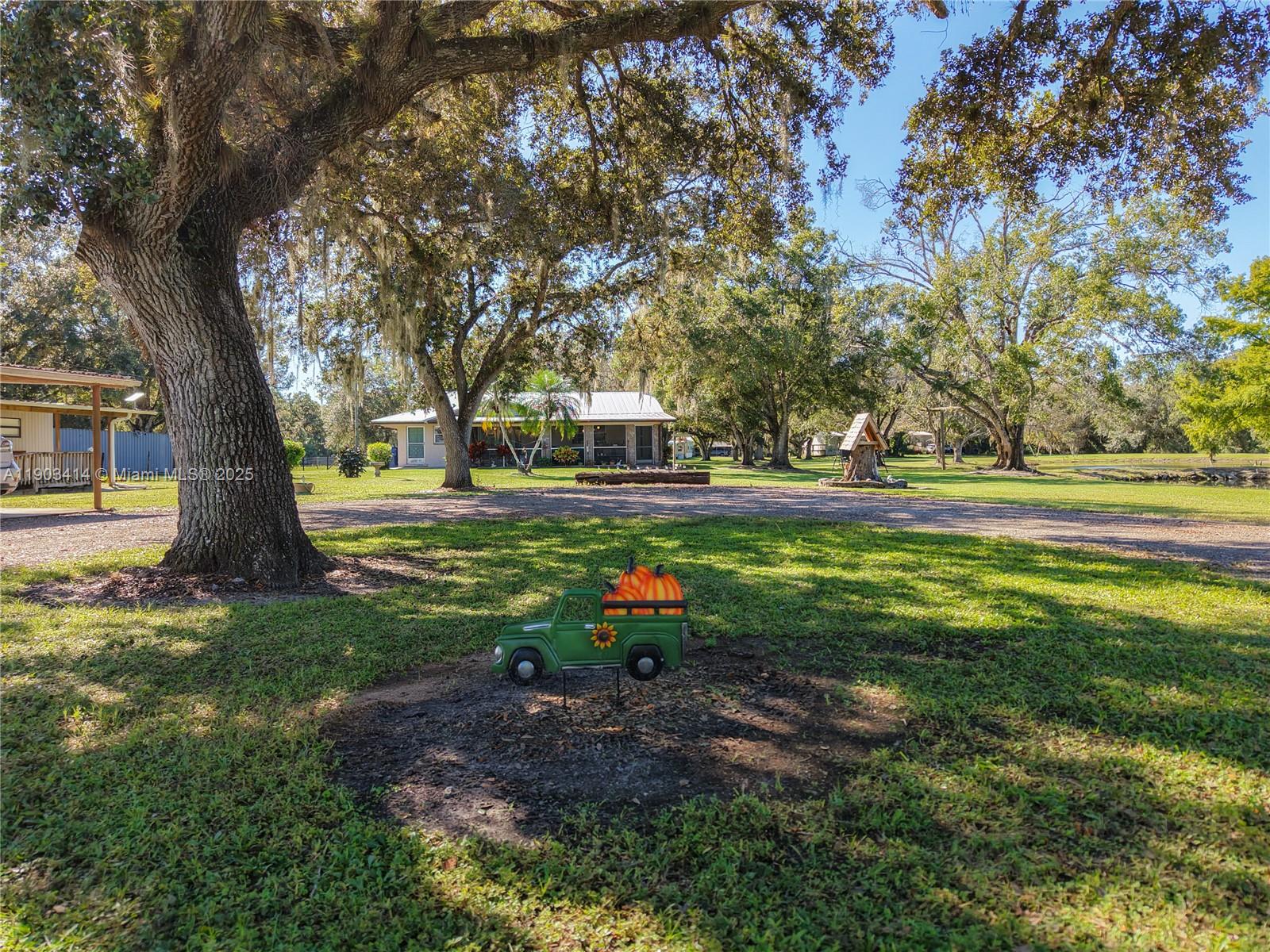 4419 Loblolly Bay Road Southwest LaBelle, FL 33935 - Photo 5 of 49 a childrens park with lots of trees and plants