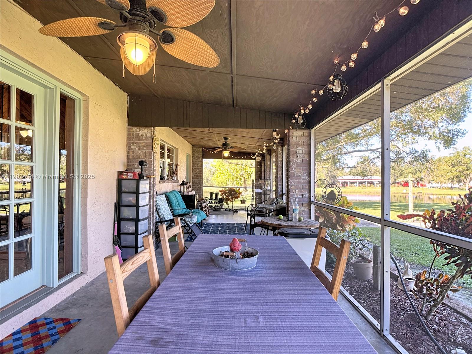 4419 Loblolly Bay Road Southwest LaBelle, FL 33935 - Photo 9 of 49 a view of a dining room with furniture water view and a large window