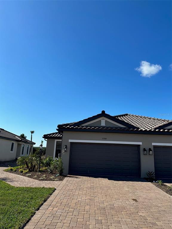 15744 Sacile Lane Bradenton, FL 34211 - Photo 1 of 1 a front view of a house with a yard