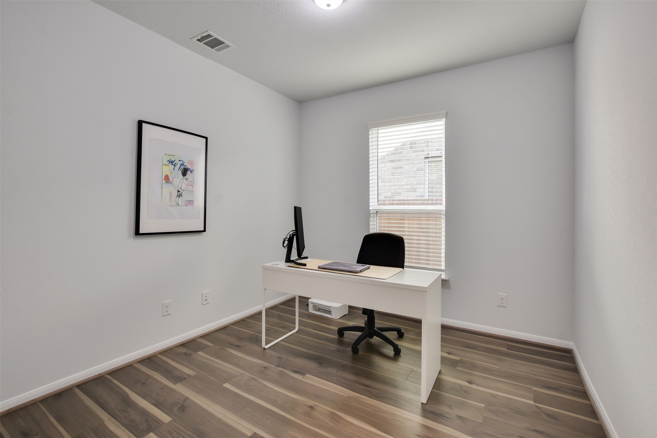 605 Oleander Loop Buda, TX 78610 - Photo 5 of 32 a workspace with wooden floor