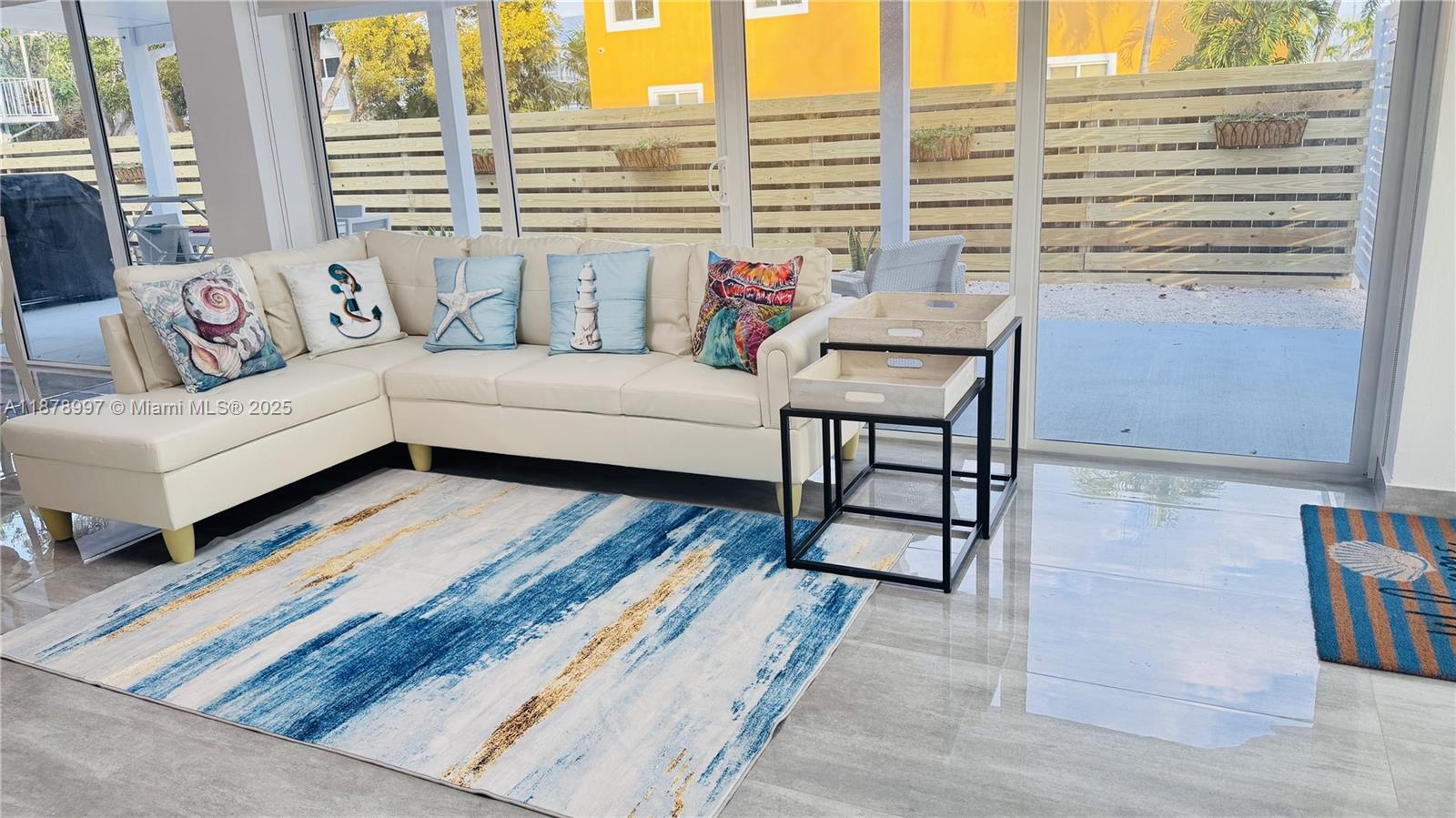 60 Southeast Marlin Avenue Key Largo, FL 33037 - Photo 11 of 40 a living room with furniture and a large window