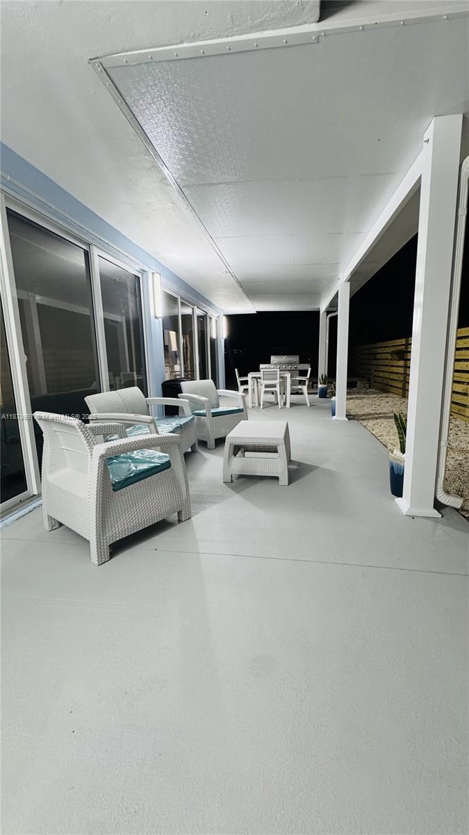 60 Southeast Marlin Avenue Key Largo, FL 33037 - Photo 14 of 40 a living room with furniture and flat screen tv