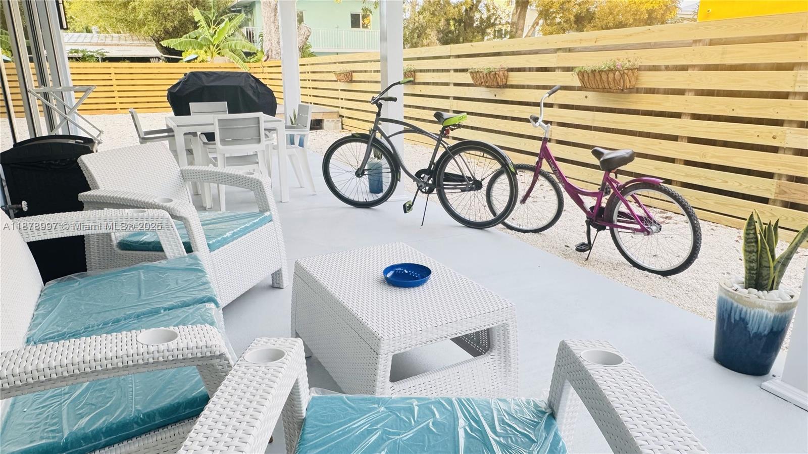 60 Southeast Marlin Avenue Key Largo, FL 33037 - Photo 16 of 40 a view of a living room with furniture and a window