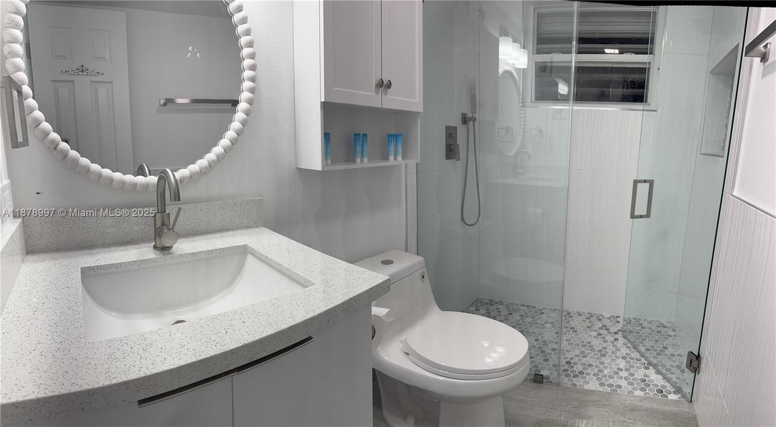 60 Southeast Marlin Avenue Key Largo, FL 33037 - Photo 27 of 40 a bathroom with a sink a toilet and shower