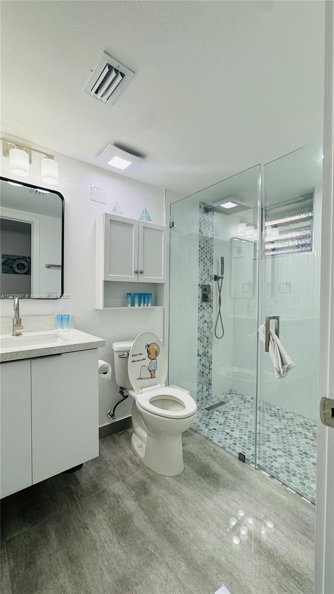 60 Southeast Marlin Avenue Key Largo, FL 33037 - Photo 9 of 40 a bathroom with a sink toilet and shower
