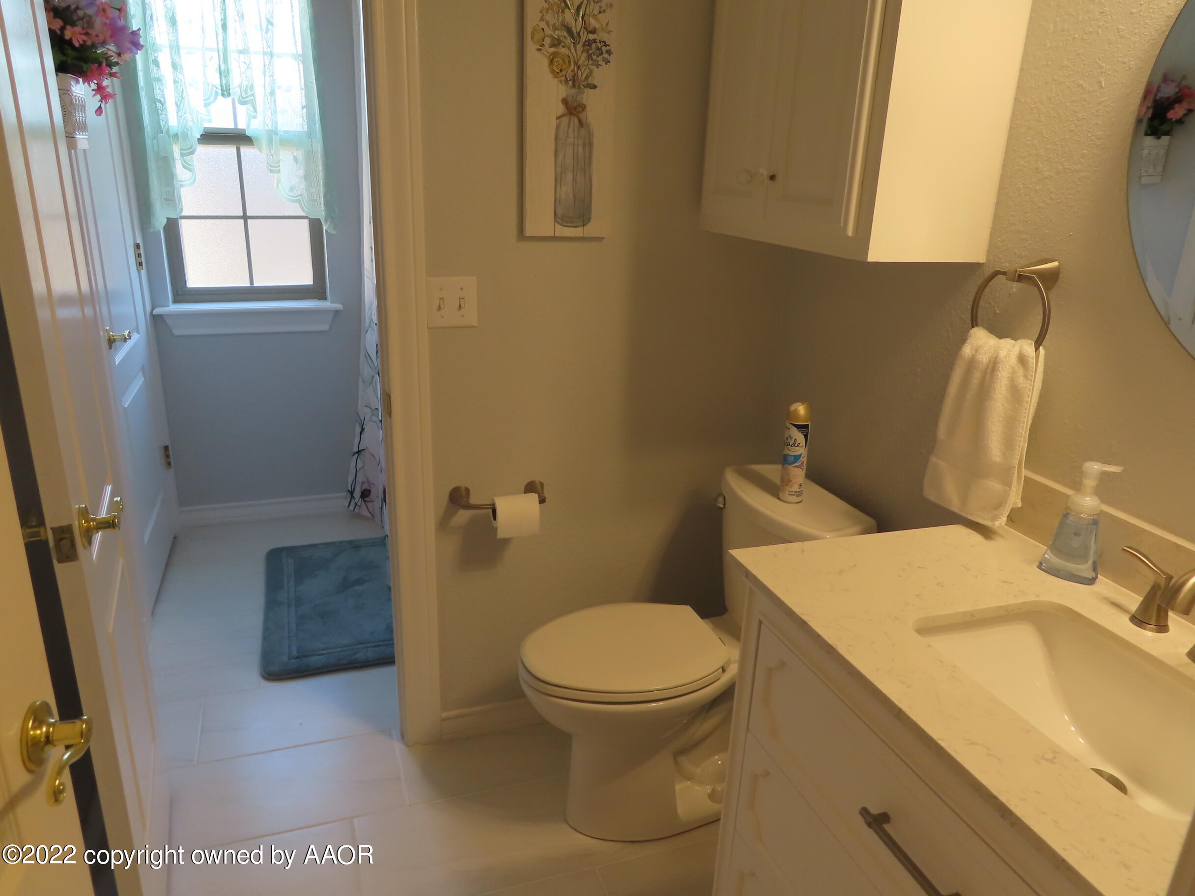 6 Monet Rue Amarillo, TX 79121 - Photo 13 of 13 a bathroom with a granite countertop toilet and a sink