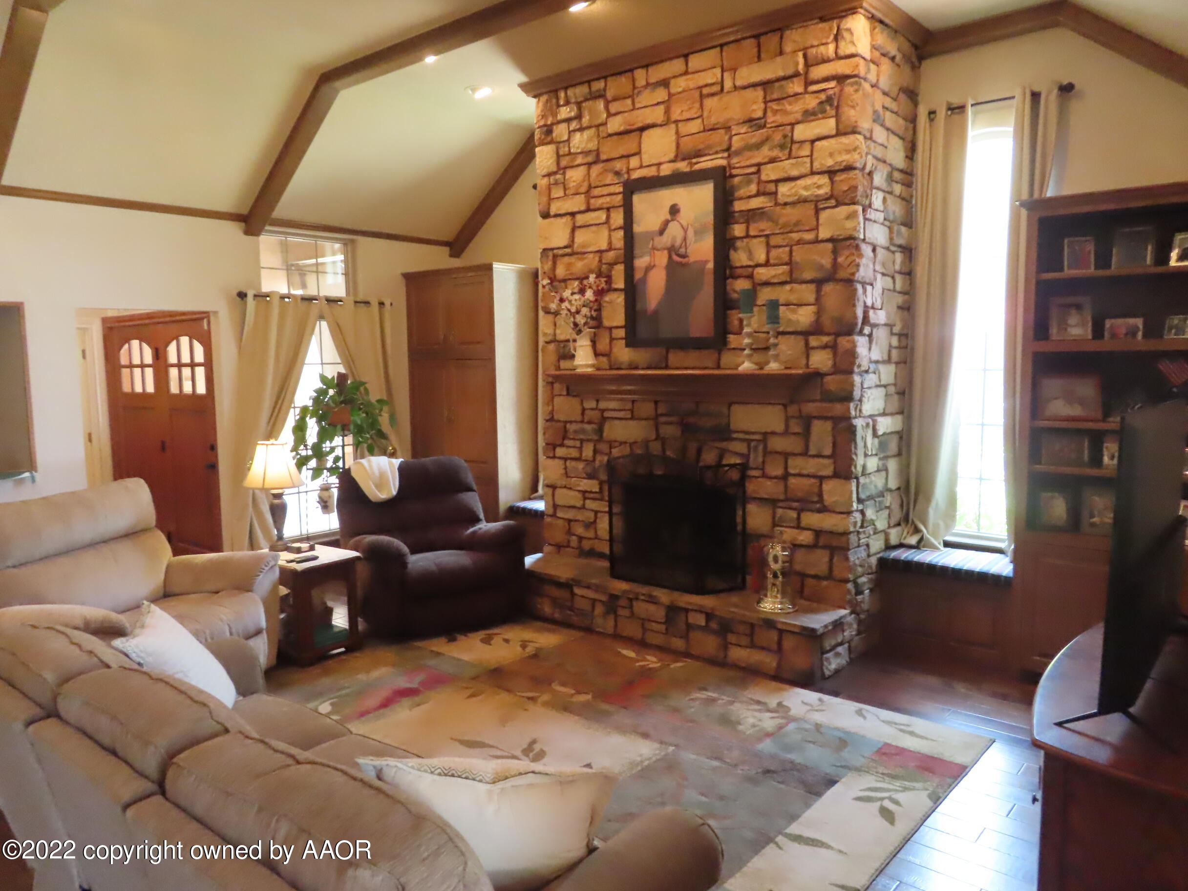 6 Monet Rue Amarillo, TX 79121 - Photo 6 of 13 a living room with furniture windows and a fireplace