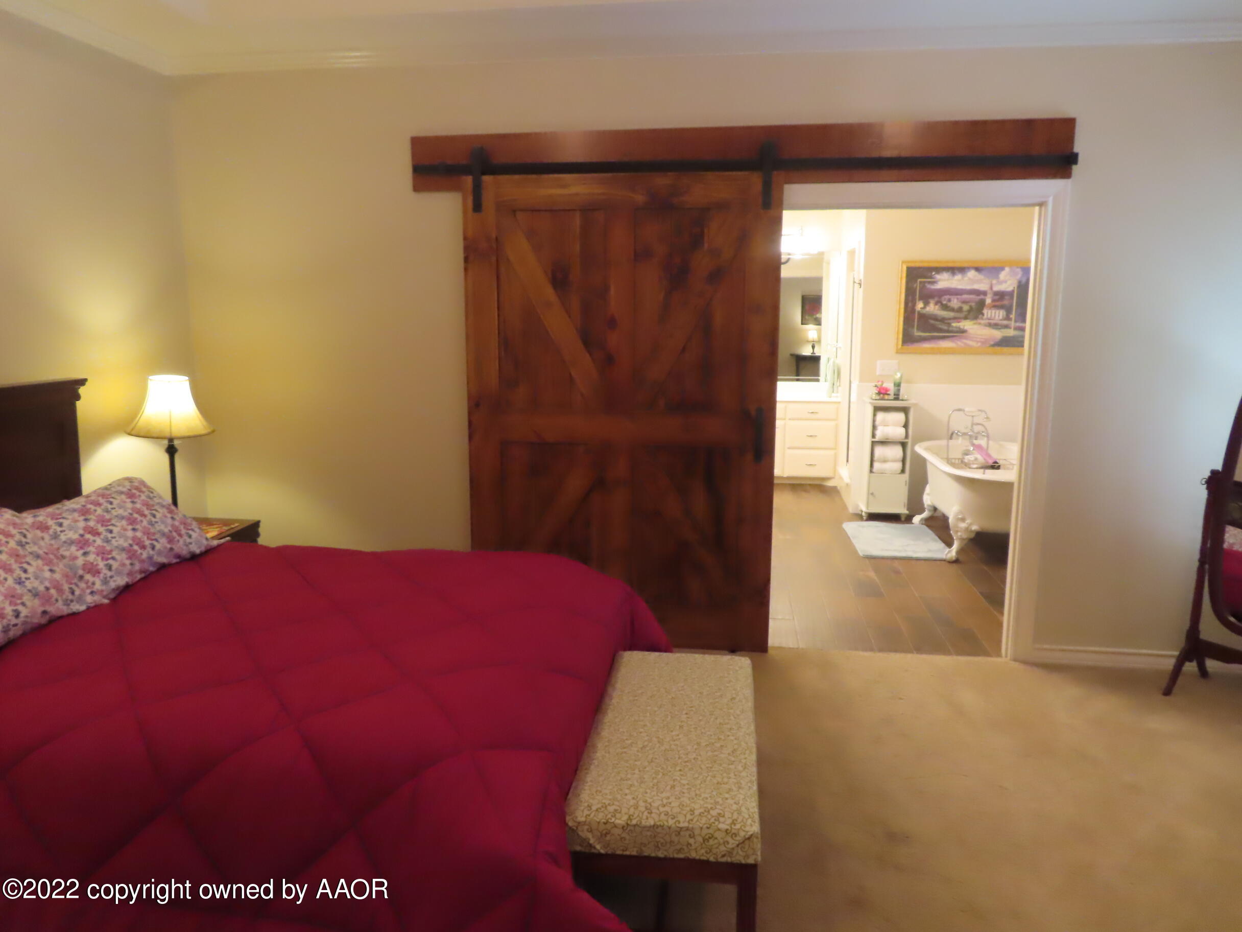 6 Monet Rue Amarillo, TX 79121 - Photo 7 of 13 a bedroom with a bed and a window