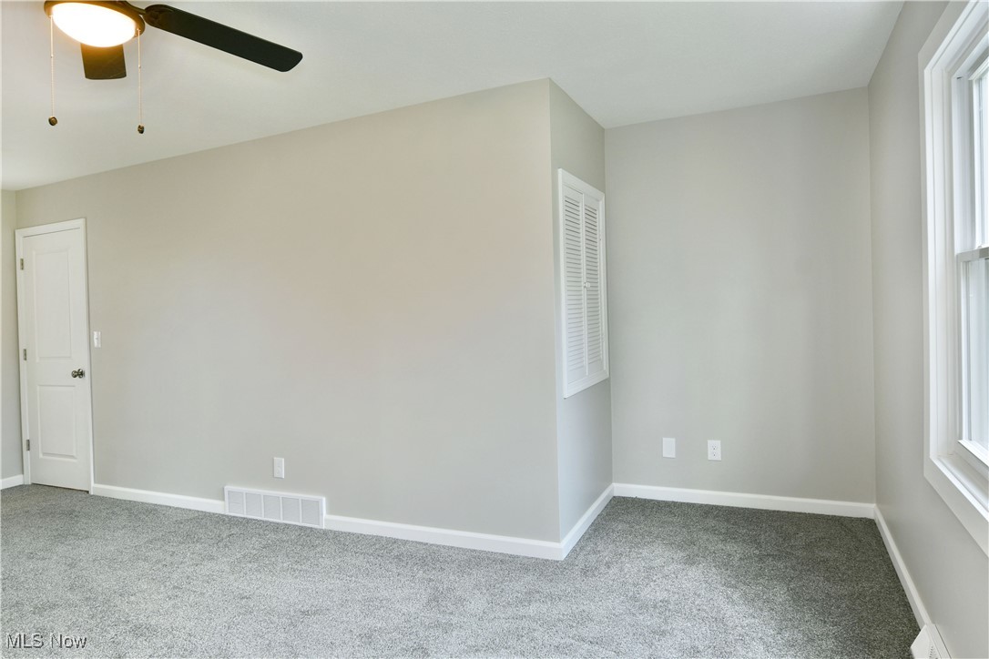 2474 Johnny Cake Road Southeast Warren, OH 44484 - Photo 26 of 50 Empty room with baseboards, carpet floors, and visible vents