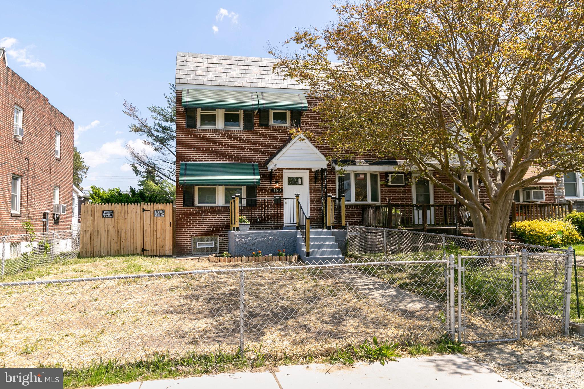 168 West Meadow Road Baltimore, MD 21225 - Photo 3 of 44 Large Fenced Front Yard with Chain Link Fence/Gate
