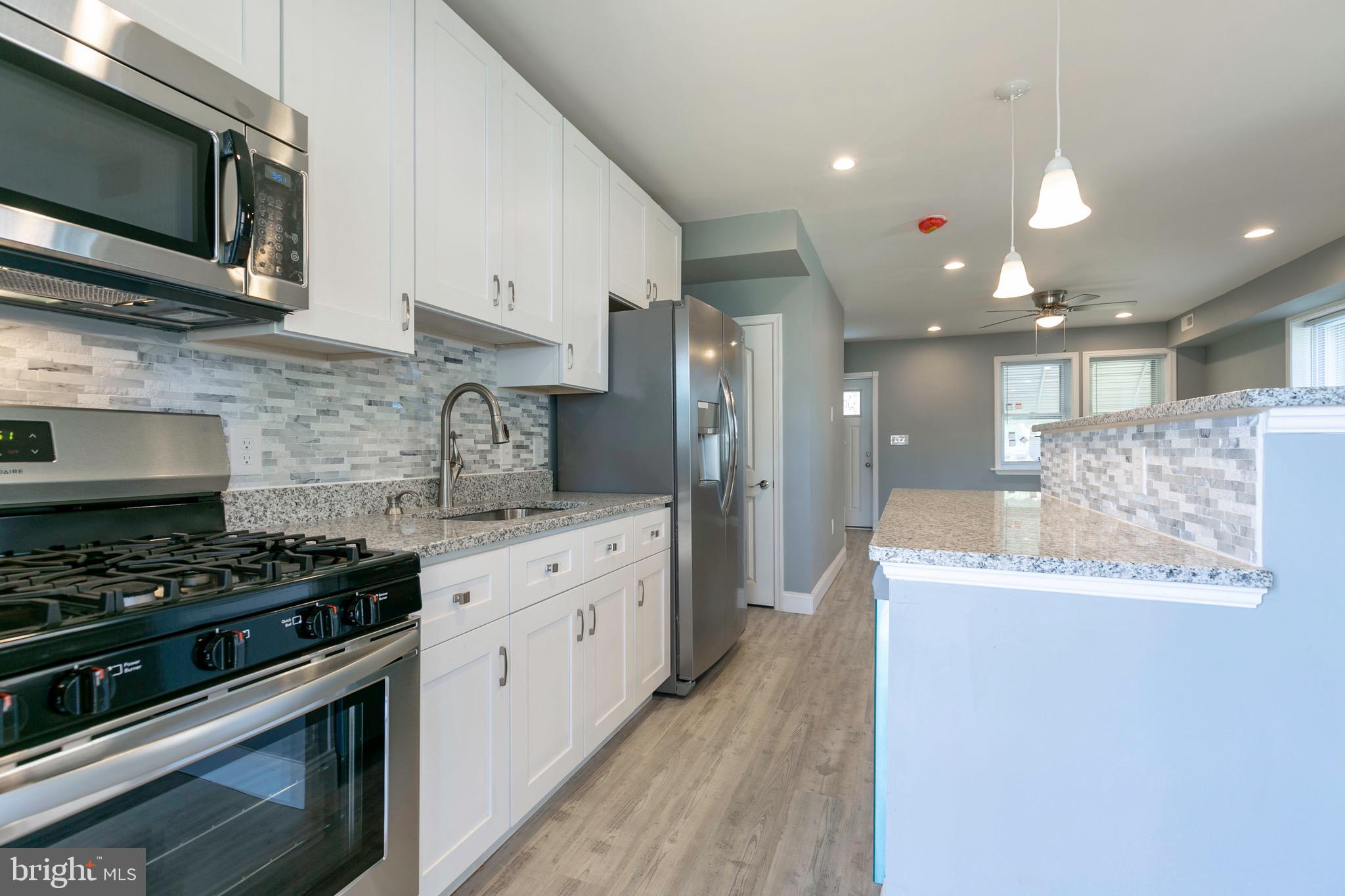 168 West Meadow Road Baltimore, MD 21225 - Photo 30 of 44 Granite Countertops & Gorgeous tile backsplash