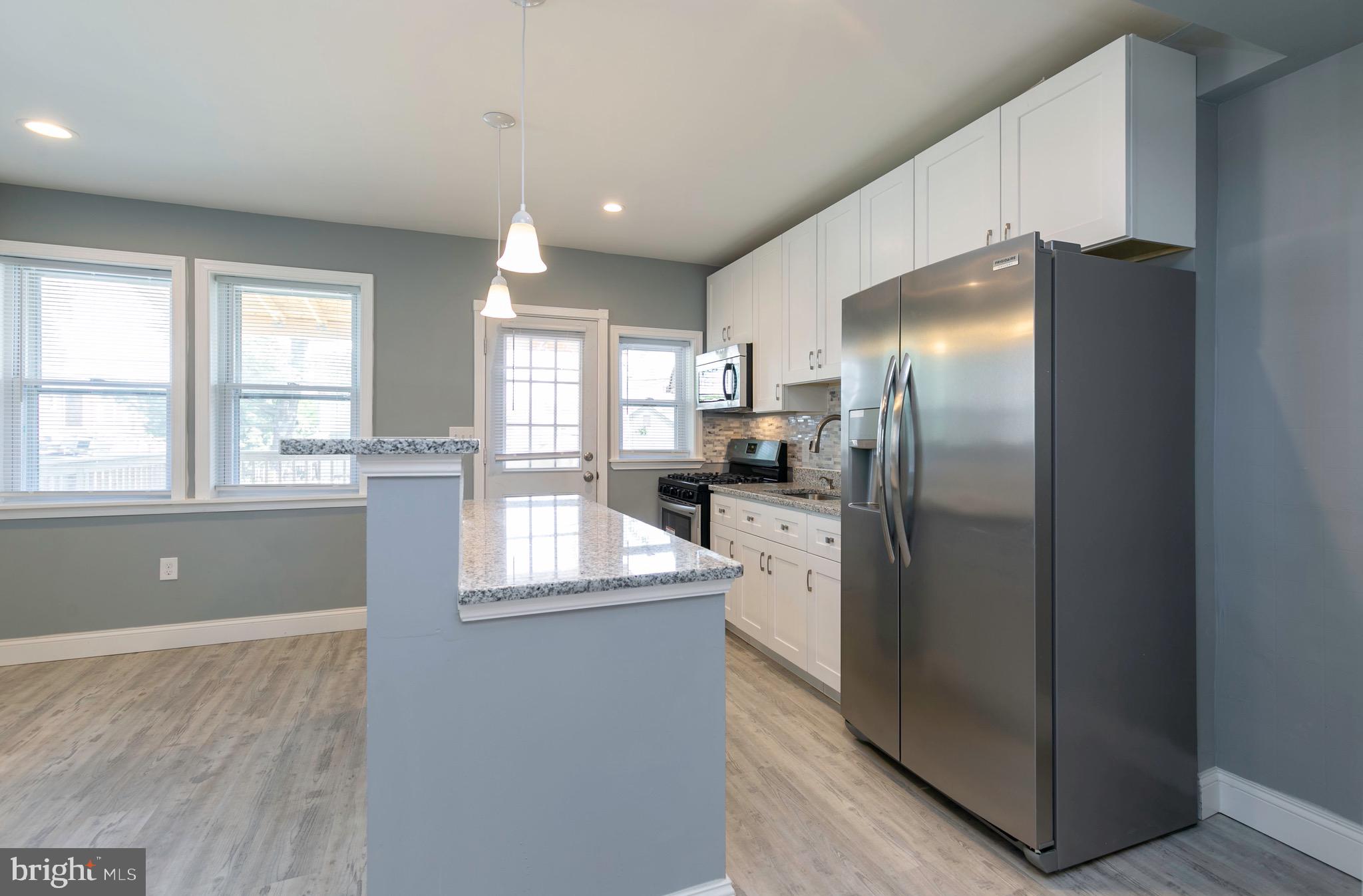 168 West Meadow Road Baltimore, MD 21225 - Photo 31 of 44 Convenient access to rear deck from kitchen