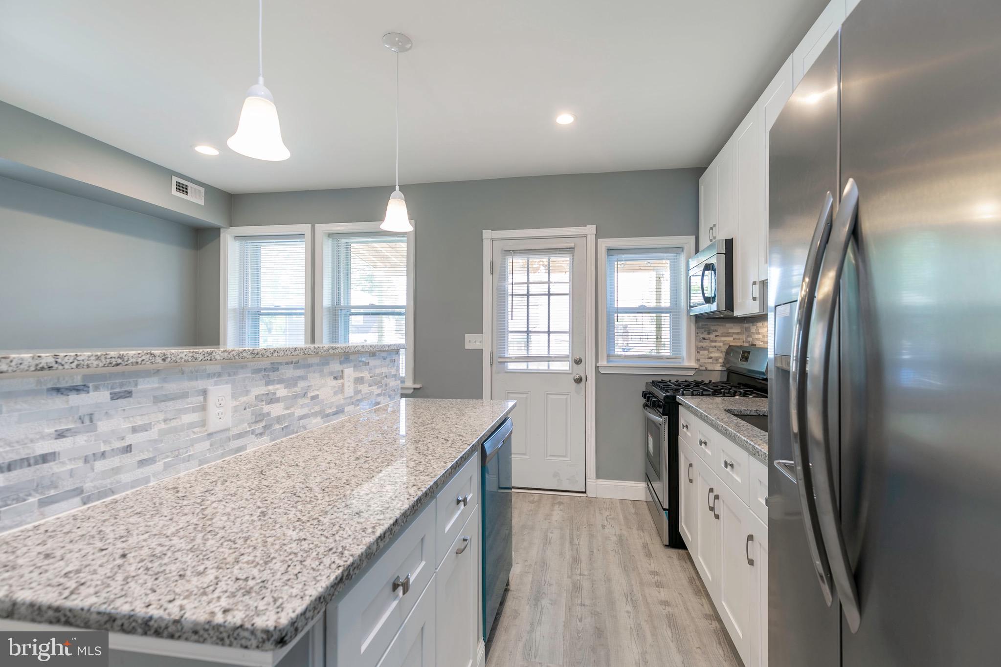 168 West Meadow Road Baltimore, MD 21225 - Photo 33 of 44 Trendy Pendulum Lighting.