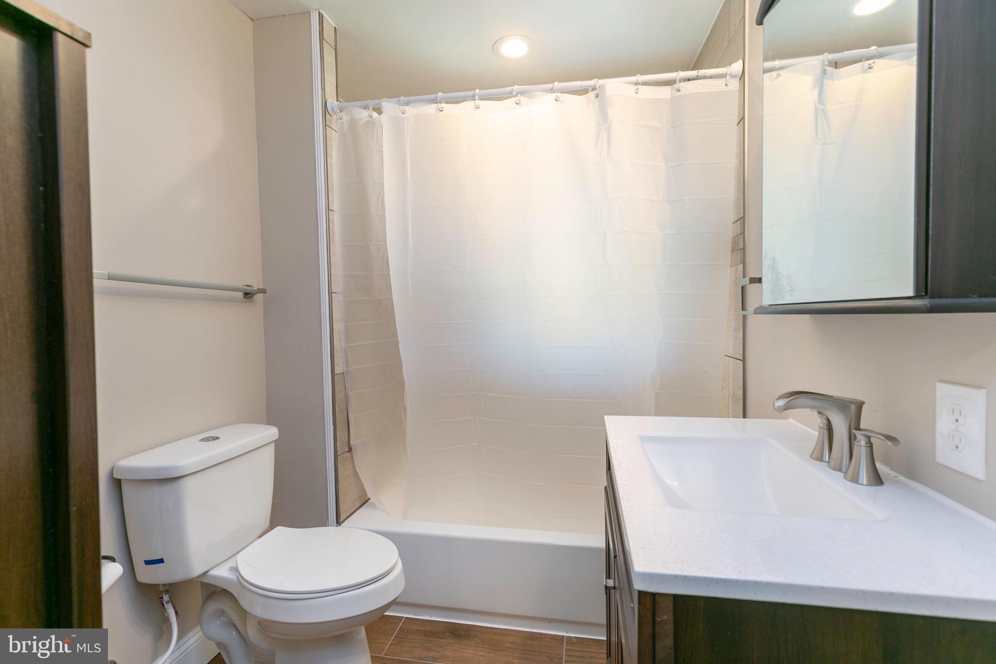 168 West Meadow Road Baltimore, MD 21225 - Photo 40 of 44 Upper Full Bath with custom tile & trendy finishes