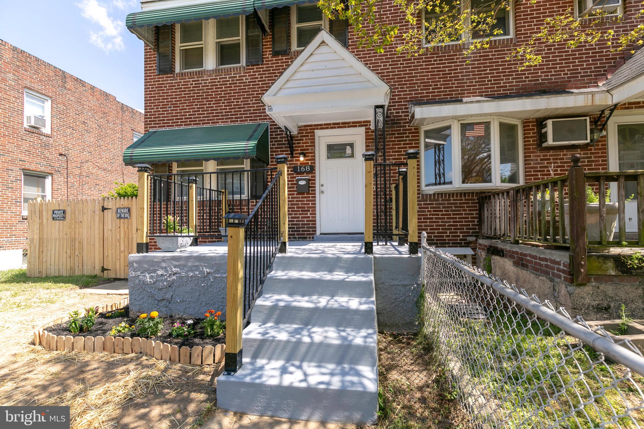 168 West Meadow Road Baltimore, MD 21225 - Photo 7 of 44 Manicured yard with lovely flower beds