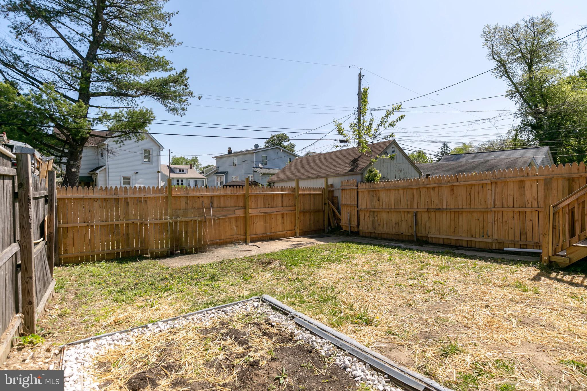 168 West Meadow Road Baltimore, MD 21225 - Photo 10 of 44 Privacy Fence in rear of home.
