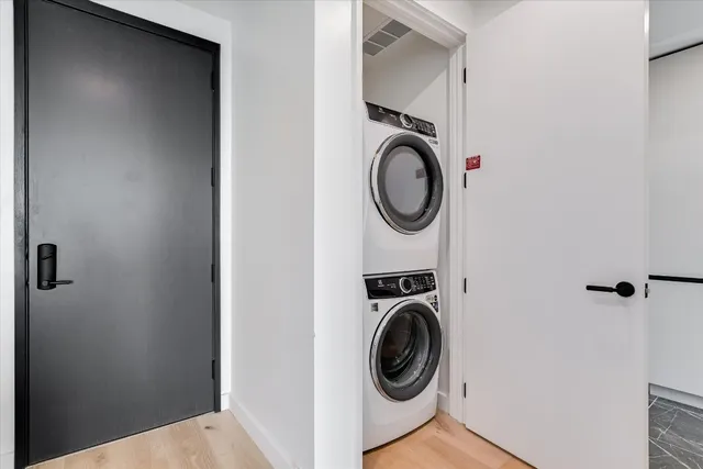 a view of a storage and utility room with washer and dryer