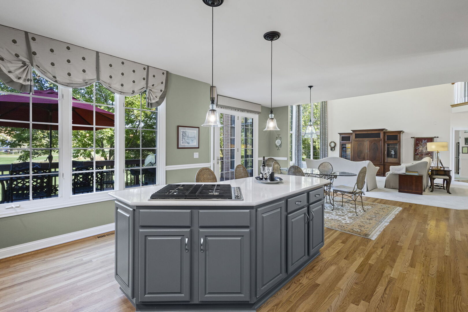 21787 Vernon Ridge Drive Mundelein, IL 60060 - Photo 12 of 38 a kitchen with stainless steel appliances granite countertop sink stove and wooden floor