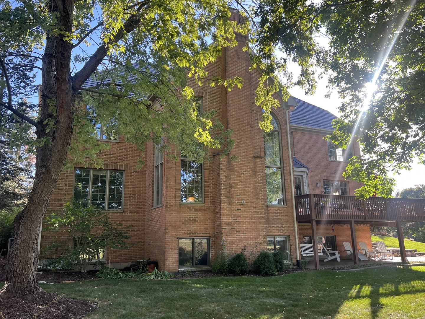 21787 Vernon Ridge Drive Mundelein, IL 60060 - Photo 31 of 38 front view of a house with a tree and a yard