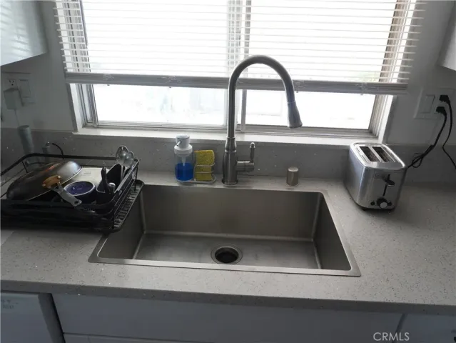 a bathroom with a sink and a window