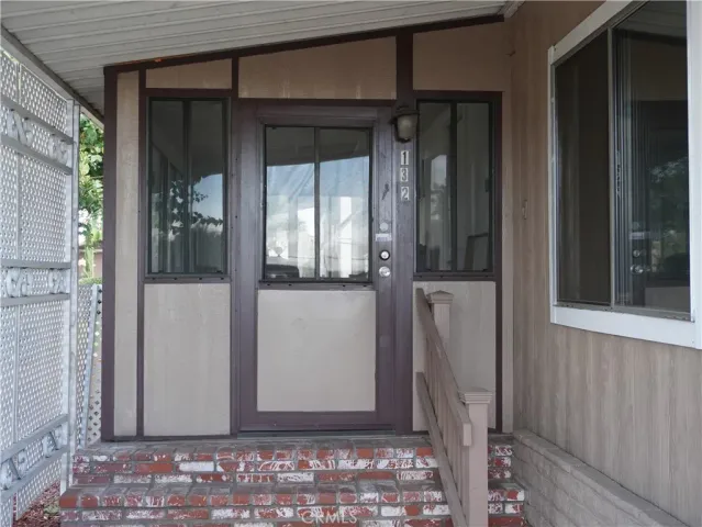 a view of a door and a window
