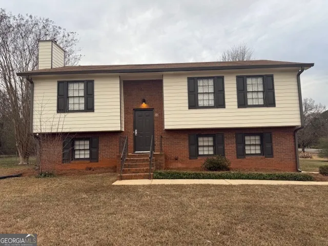 a front view of a house with garage