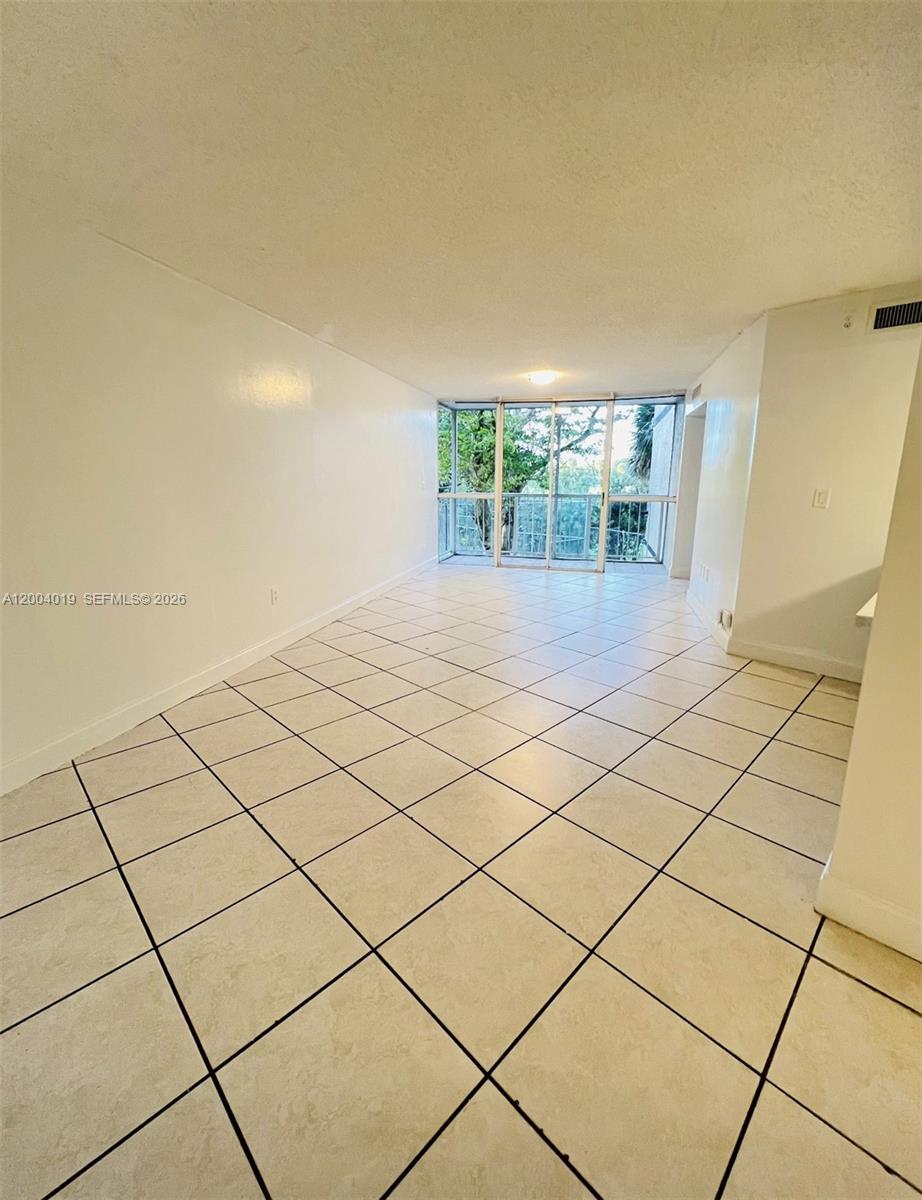 7075 Northwest 186th Street, Unit C205 Hialeah, FL 33015 - Photo 3 of 4 a view of a room & utility room