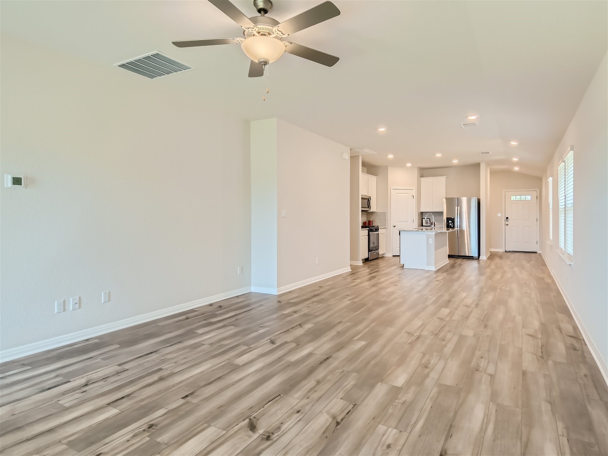 512 Dayspring Cove Georgetown, TX 78628 - Photo 27 of 27 expansive living area with luxury vinyl flooring