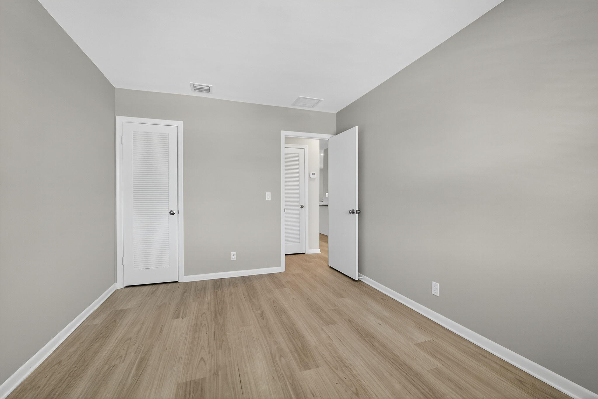 42 Easthampton B West Palm Beach, FL 33417 - Photo 23 of 37 a view of an empty room with wooden floor