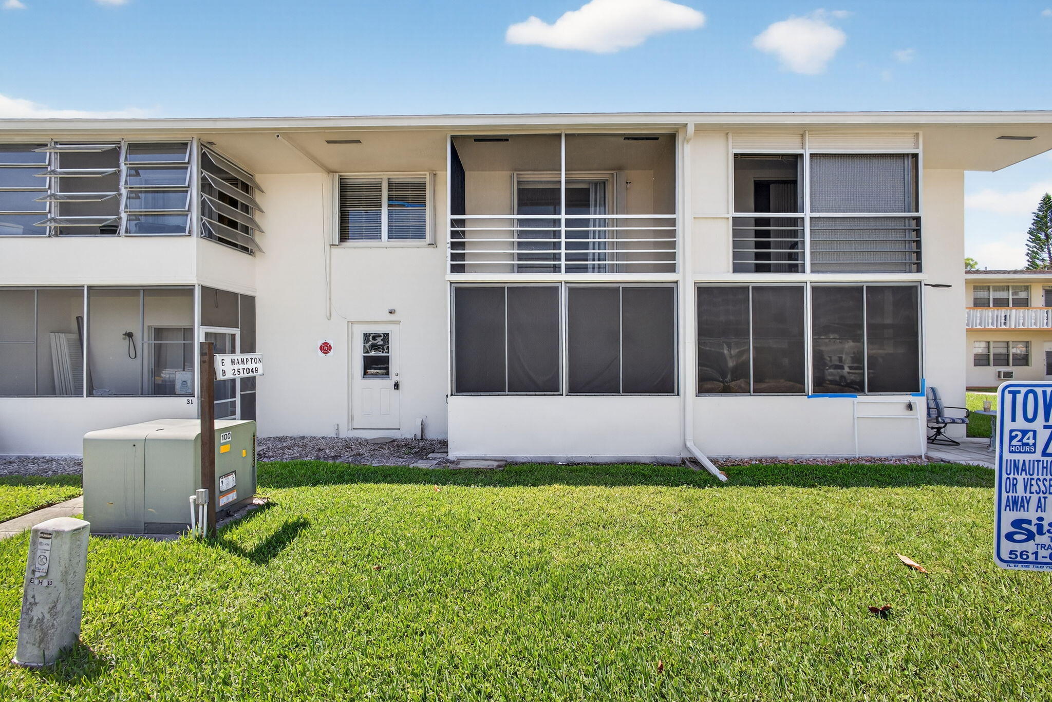 42 Easthampton B West Palm Beach, FL 33417 - Photo 27 of 37 a view of an house with backyard space and a swimming pool