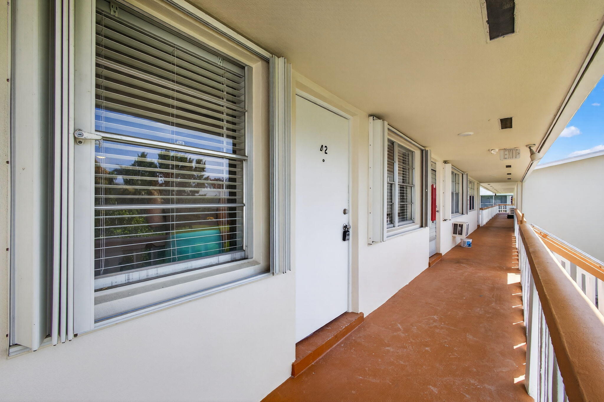 42 Easthampton B West Palm Beach, FL 33417 - Photo 36 of 37 a view of a hallway with window and stairs