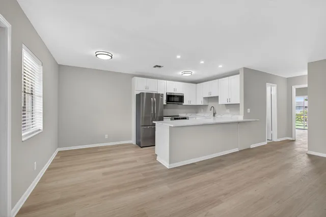 a view of kitchen with wooden floor
