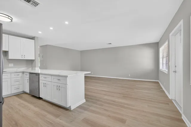 a view of cabinets and wooden floor