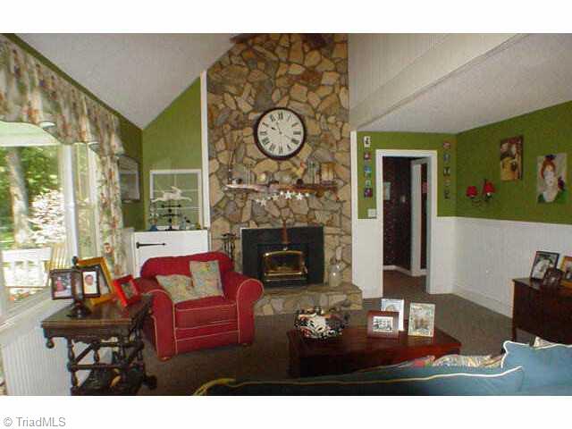1674 Hauser Road Lewisville, NC 27023 - Photo 2 of 9 Other. Two story living room with stone fireplace and large picture window.