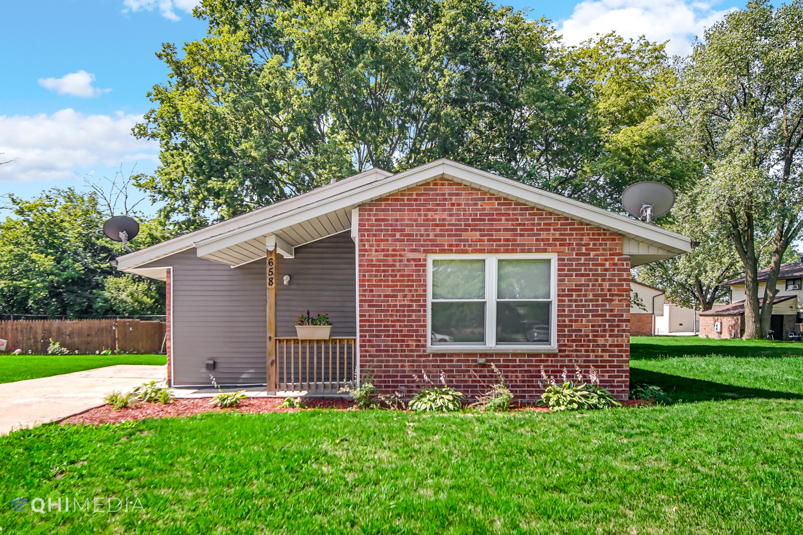 658 Eastview Drive Kankakee, IL 60901 - Photo 1 of 17 a front view of a house with a yard and garage