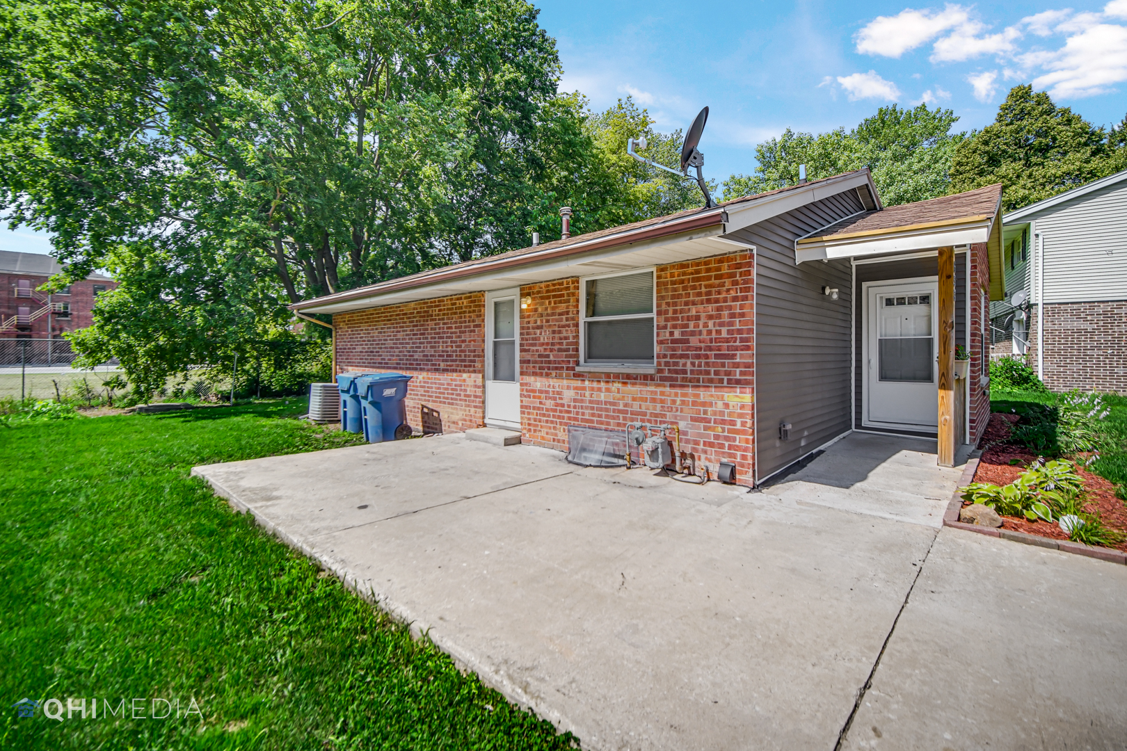 658 Eastview Drive Kankakee, IL 60901 - Photo 2 of 17 a front view of house with yard and trees in the background