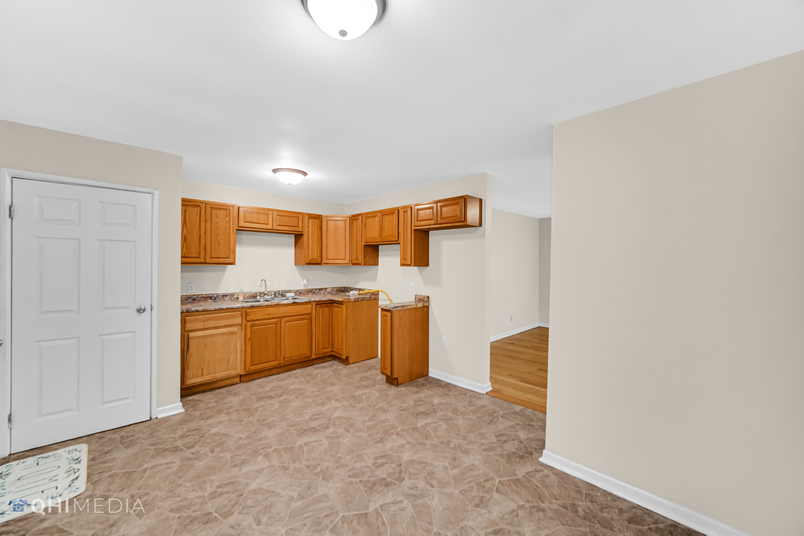 658 Eastview Drive Kankakee, IL 60901 - Photo 7 of 17 a kitchen with a refrigerator and a sink