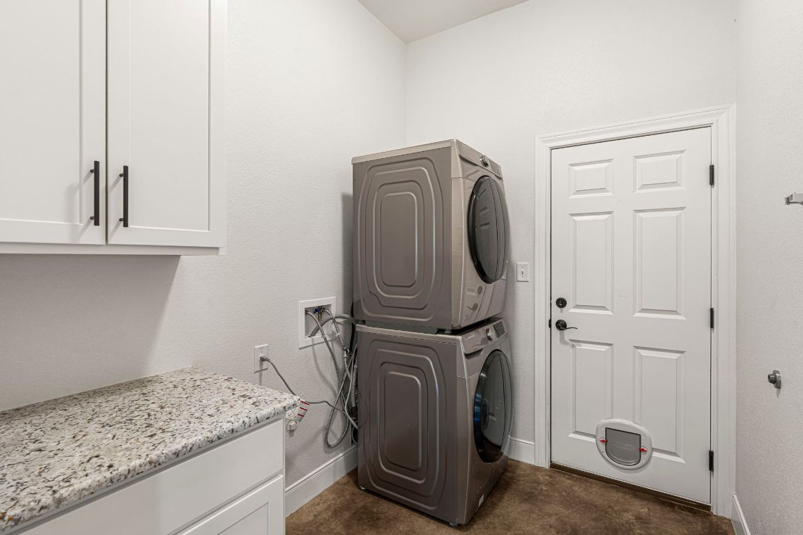 203 Cardinal Loop Paige, TX 78659 - Photo 12 of 36 a utility room with dryer and washer