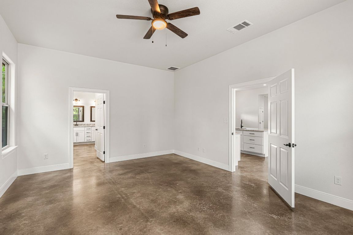 203 Cardinal Loop Paige, TX 78659 - Photo 14 of 36 an empty room with a empty space and windows