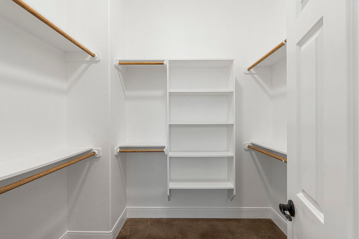 203 Cardinal Loop Paige, TX 78659 - Photo 17 of 36 a view of a room with rack on the wall