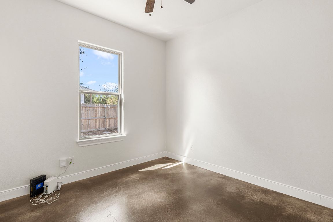 203 Cardinal Loop Paige, TX 78659 - Photo 20 of 36 an empty room with a window